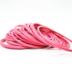 Overlapping pink sealing rings on a white background