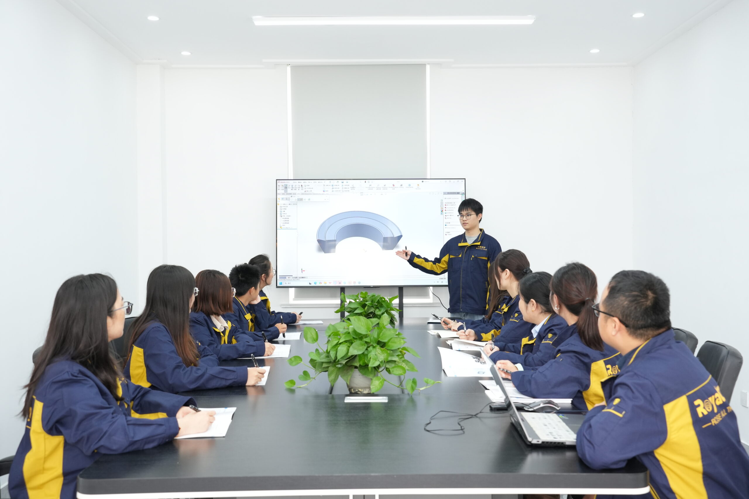 A detailed macro shot of a black rubber seal with a textured surface